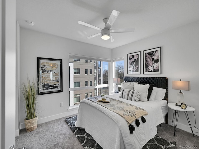 bedroom featuring a ceiling fan, baseboards, and carpet floors