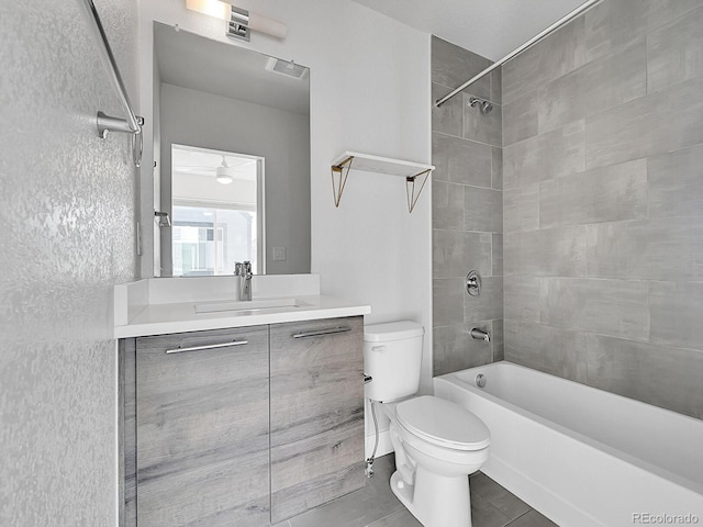 full bath featuring vanity, toilet, washtub / shower combination, and visible vents