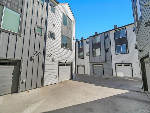 exterior space featuring a garage and concrete driveway