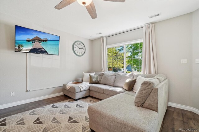 6142 Gorham St, Frederick, CO 80530 - living area featuring wood finished floors, baseboards, and ceiling fan