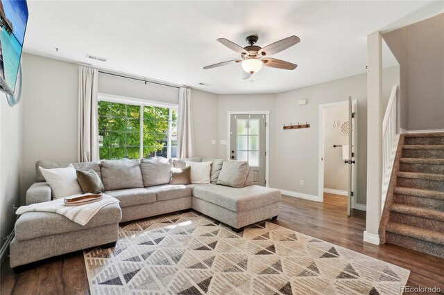 6142 Gorham St, Frederick, CO 80530 - living room with stairway, wood finished floors, a ceiling fan, and baseboards