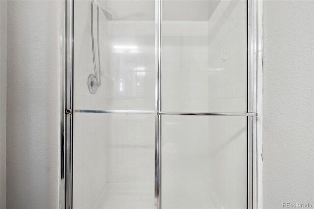 6142 Gorham St, Frederick, CO 80530 - full bath with a shower stall and a textured wall