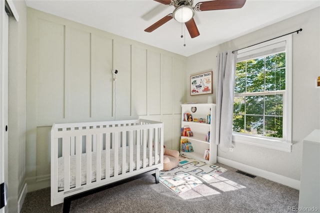 6142 Gorham St, Frederick, CO 80530 - carpeted bedroom featuring a nursery area, baseboards, and a ceiling fan