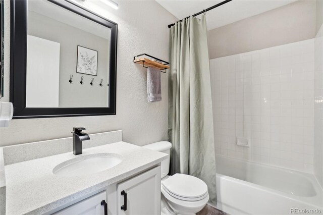 6142 Gorham St, Frederick, CO 80530 - bathroom with a textured wall, vanity, toilet, and shower / tub combo with curtain