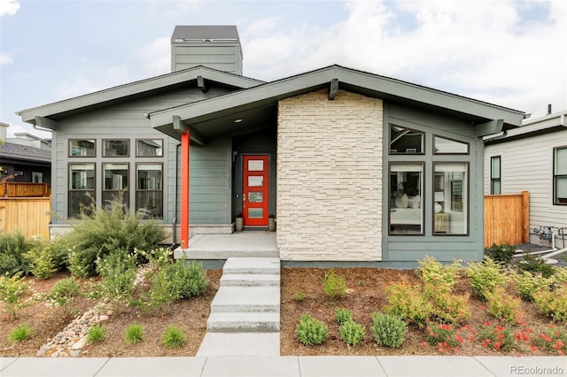 6251 N Galena St, Denver, CO 80238 - view of front facade with a chimney