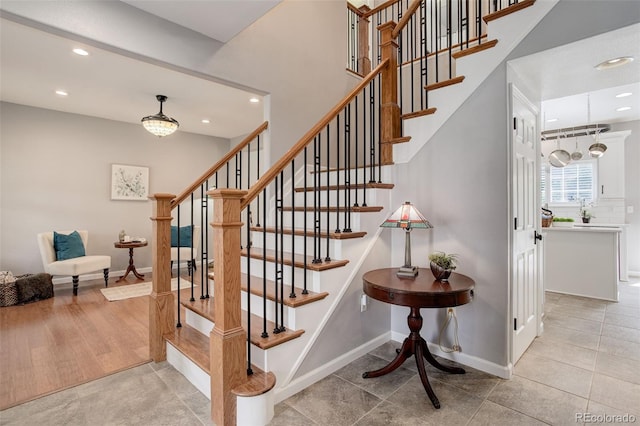 9954 Heywood St, Highlands Ranch, CO 80130 - stairway with recessed lighting, baseboards, and tile patterned floors