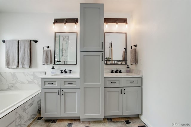 9954 Heywood St, Highlands Ranch, CO 80130 - bathroom featuring double vanity, a garden tub, and a marble finish shower
