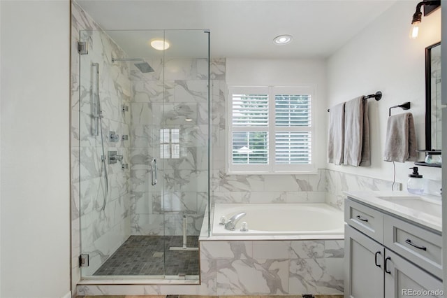 9954 Heywood St, Highlands Ranch, CO 80130 - bathroom featuring a bath, vanity, a marble finish shower, and recessed lighting