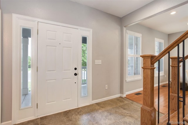 9954 Heywood St, Highlands Ranch, CO 80130 - foyer entrance with baseboards, stairway, and recessed lighting
