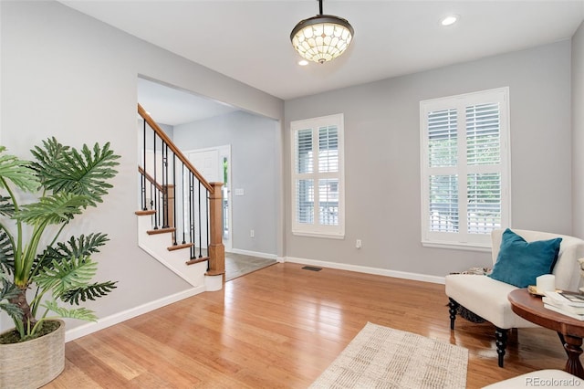 9954 Heywood St, Highlands Ranch, CO 80130 - living area featuring light wood-style flooring, stairway, baseboards, a chandelier, and recessed lighting