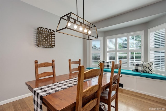 9954 Heywood St, Highlands Ranch, CO 80130 - dining space with light wood-style flooring, healthy amount of natural light, and baseboards
