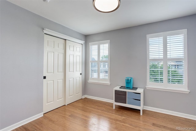 9954 Heywood St, Highlands Ranch, CO 80130 - bedroom with baseboards, light wood finished floors, and a closet