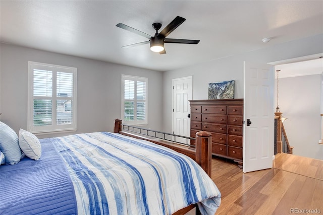 9954 Heywood St, Highlands Ranch, CO 80130 - bedroom with light wood-type flooring and a ceiling fan