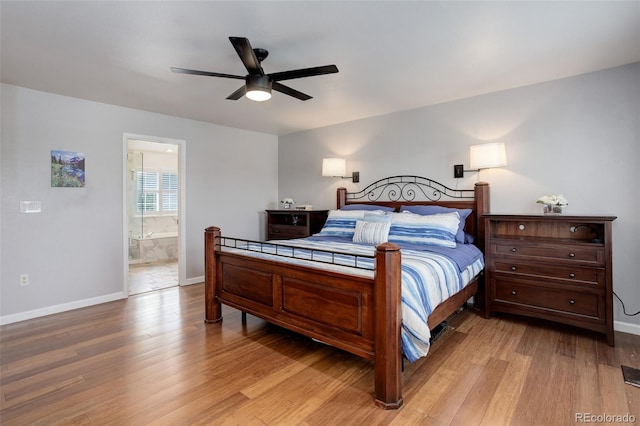 9954 Heywood St, Highlands Ranch, CO 80130 - bedroom with light wood-style floors, baseboards, connected bathroom, and a ceiling fan