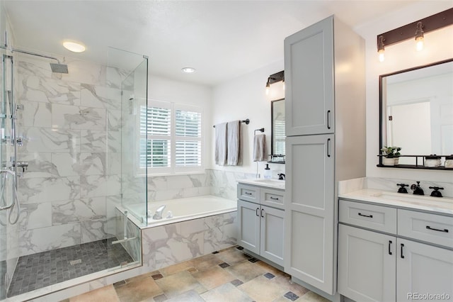 9954 Heywood St, Highlands Ranch, CO 80130 - full bathroom featuring a marble finish shower, a garden tub, and two vanities
