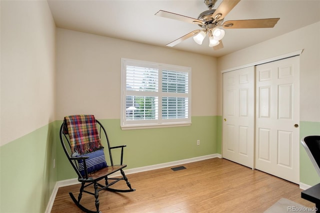 9954 Heywood St, Highlands Ranch, CO 80130 - living area with light wood-type flooring, a ceiling fan, and baseboards
