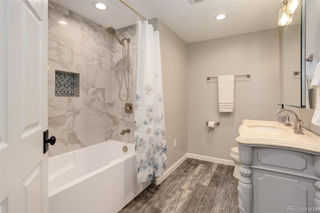 9954 Heywood St, Highlands Ranch, CO 80130 - bathroom with recessed lighting, shower / bath combo, wood finish floors, vanity, and toilet