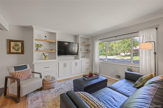13402 W 24th Pl, Golden, CO 80401 - living room with light wood-style flooring and baseboards