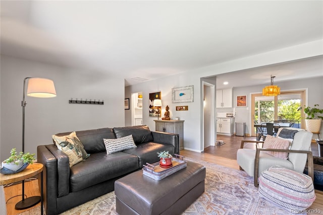 13402 W 24th Pl, Golden, CO 80401 - living room with light wood-style flooring and baseboards