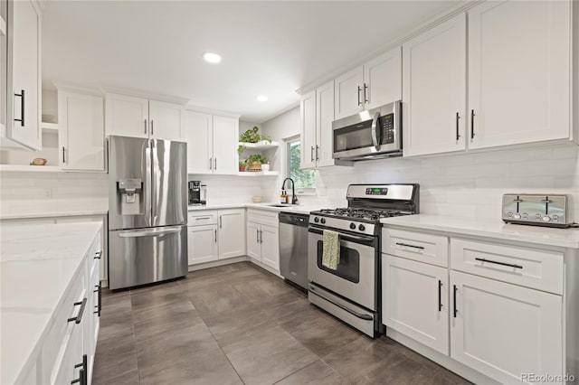 13402 W 24th Pl, Golden, CO 80401 - kitchen featuring appliances with stainless steel finishes, open shelves, white cabinetry, and recessed lighting