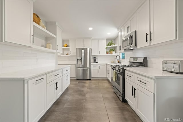 13402 W 24th Pl, Golden, CO 80401 - kitchen featuring open shelves, stainless steel appliances, white cabinets, backsplash, and recessed lighting