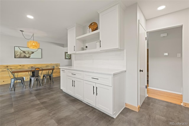 13402 W 24th Pl, Golden, CO 80401 - kitchen featuring open shelves, light countertops, white cabinetry, baseboards, and recessed lighting