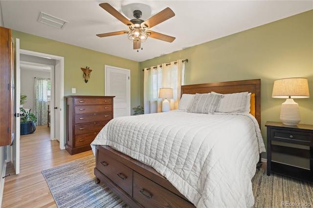 13402 W 24th Pl, Golden, CO 80401 - bedroom featuring light wood-type flooring, a closet, and ceiling fan