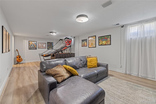 13402 W 24th Pl, Golden, CO 80401 - living room featuring light wood finished floors and baseboards