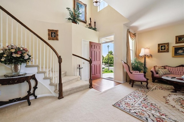 17298 E Lake Pl, Aurora, CO 80016 - carpeted foyer featuring stairs and a high ceiling
