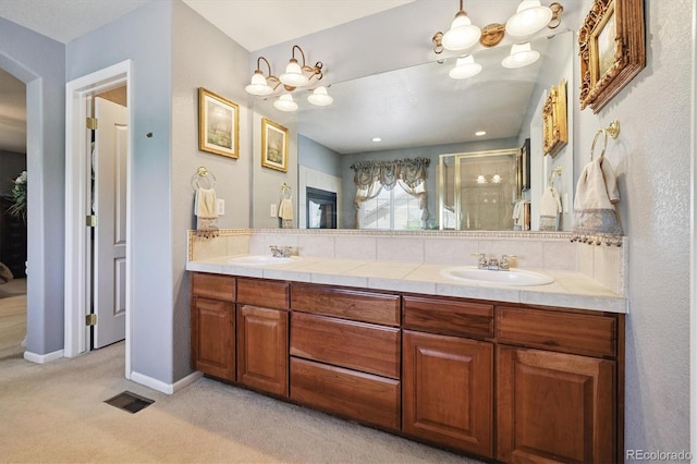 17298 E Lake Pl, Aurora, CO 80016 - bathroom featuring a stall shower and double vanity