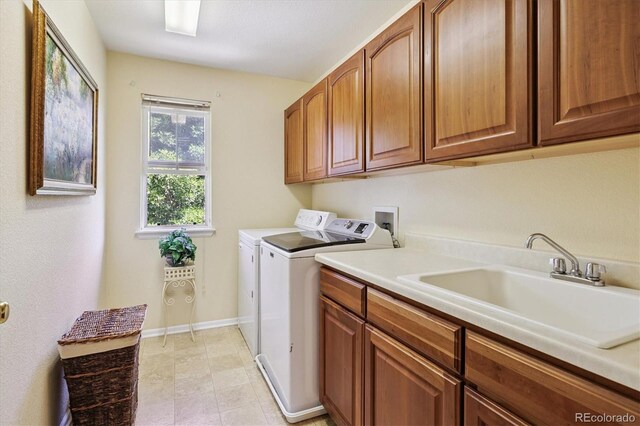 17298 E Lake Pl, Aurora, CO 80016 - laundry area with cabinet space and washing machine and dryer