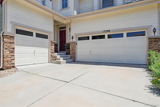 17298 E Lake Pl, Aurora, CO 80016 - garage with concrete driveway