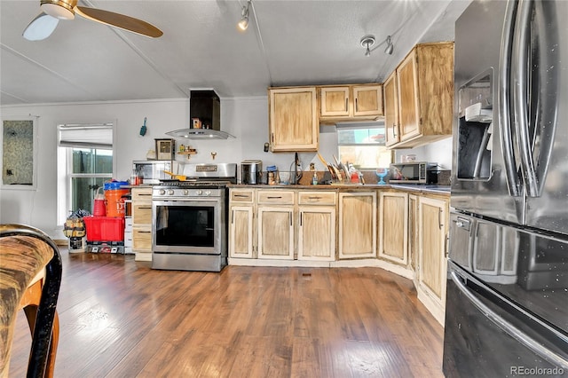 8430 Madison Way, Denver, CO 80229 - kitchen with appliances with stainless steel finishes, wall chimney exhaust hood, track lighting, light brown cabinets, and dark wood-type flooring