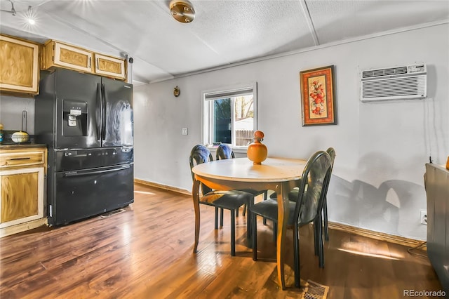 8430 Madison Way, Denver, CO 80229 - dining area with an AC wall unit, dark wood-style flooring, and baseboards