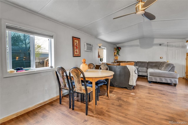 8430 Madison Way, Denver, CO 80229 - dining space featuring wood finished floors, lofted ceiling, ceiling fan, an AC wall unit, and baseboards