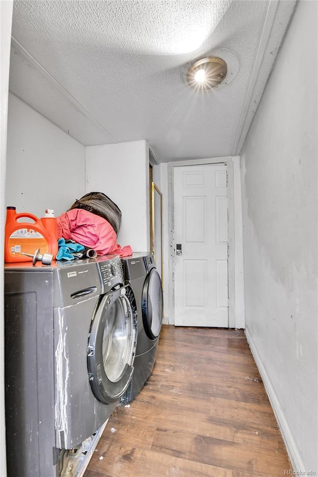 8430 Madison Way, Denver, CO 80229 - laundry room featuring washing machine and dryer, wood finished floors, a textured ceiling, and baseboards