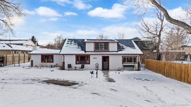 view of snow covered house