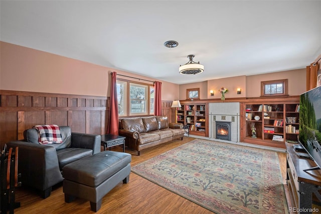 living room with hardwood / wood-style flooring and a wealth of natural light