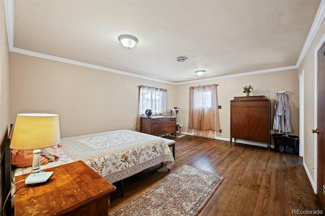 bedroom featuring ornamental molding and dark hardwood / wood-style flooring