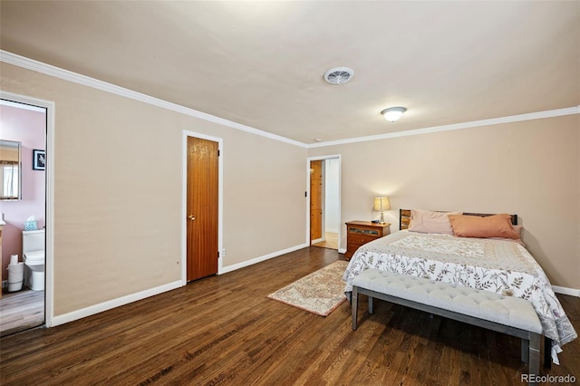 bedroom featuring connected bathroom, dark hardwood / wood-style floors, and crown molding