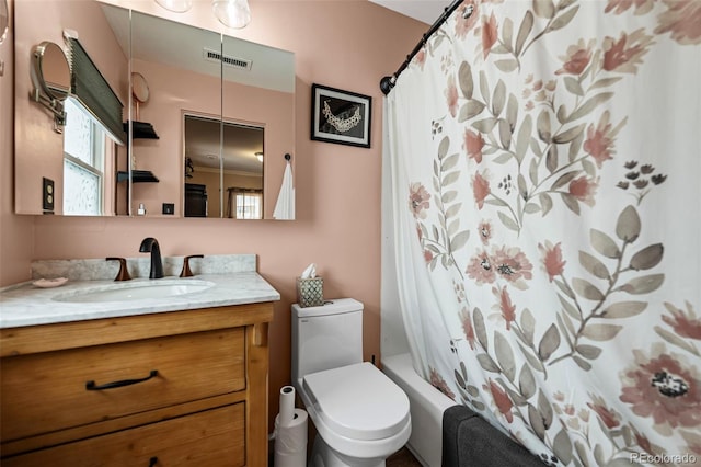 full bathroom featuring vanity, toilet, and shower / bath combo with shower curtain