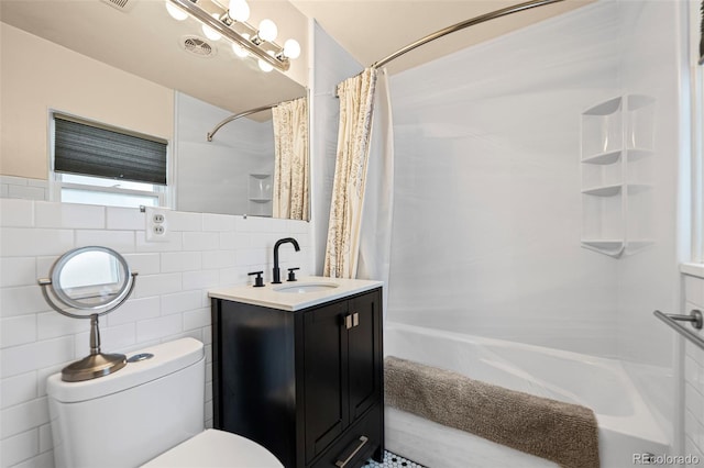 full bathroom with shower / bath combo, backsplash, toilet, and tile walls