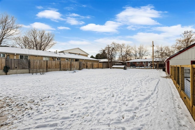 view of yard covered in snow