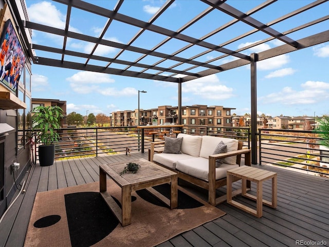 wooden terrace featuring a pergola and an outdoor hangout area