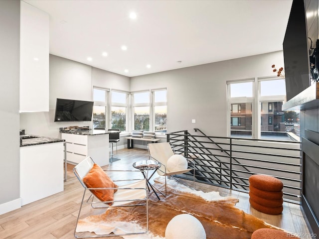 interior space with recessed lighting, light wood-style flooring, and baseboards