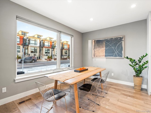 dining space featuring recessed lighting, visible vents, baseboards, and wood finished floors