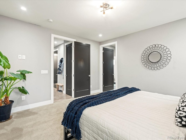 bedroom featuring recessed lighting, light carpet, and baseboards