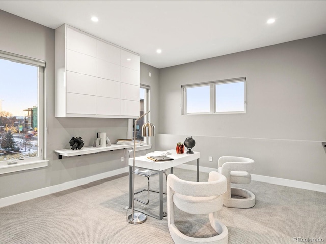 home office with recessed lighting, light colored carpet, and baseboards