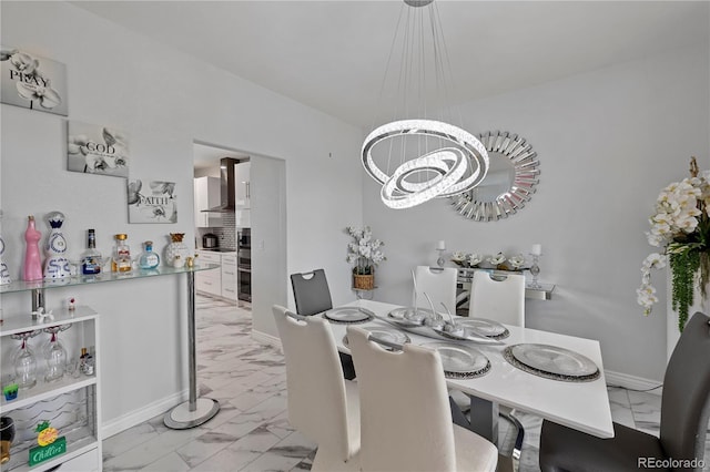 12404 Pine Valley Cir, Peyton, CO 80831 - dining space with light marble finish flooring and a chandelier