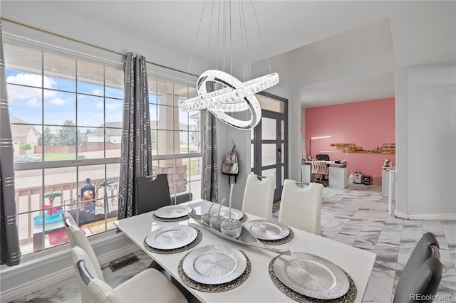 12404 Pine Valley Cir, Peyton, CO 80831 - dining area with marble finish floors and plenty of natural light